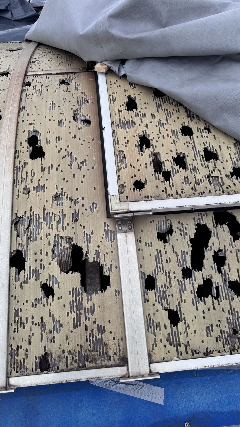 Hail damage to a PC panel